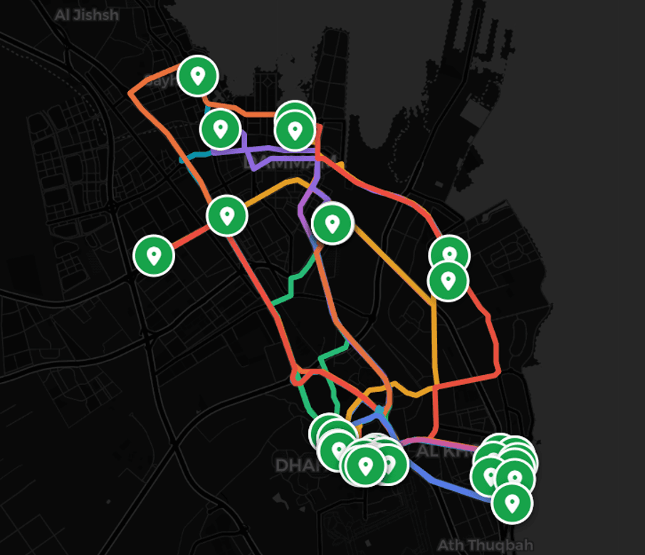 SMART COMMUTE route map showing colored bus routes and station markers across Dhahran and Al Khobar.